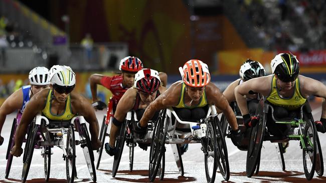 Madison de Rozario (left) Eliza Ault-Connell and Angela Ballard of Australia in action during the Women's T54 1500m at the last Commonwealth Games.