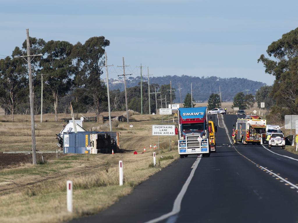 Emergency services at the scene of a serious crash on the Warrego Highway, east of Oakey, Sunday, June 9, 2024. Picture: Kevin Farmer