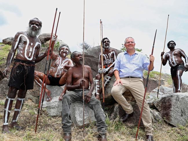 Prime Minister Scott Morrison with the people of the Guguyimithirr tribe at Reconciliation Rocks, Cooktown, Tuesday, January 22, 2019. Scott Morrison visited Cooktown to announce $5.5 million to support Cooktown's 2020 Festival. (AAP Image/Marc McCormack) NO ARCHIVING