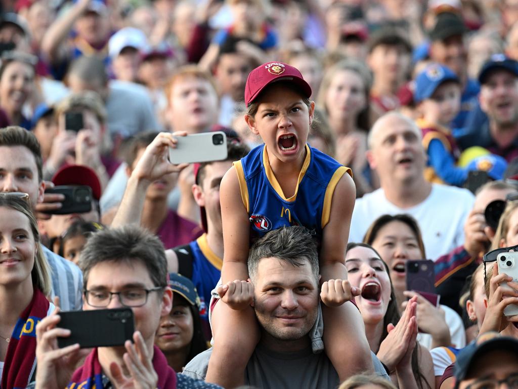 IPSWICH, AUSTRALIA - SEPTEMBER 29: Fans celebrate at Brighton Homes Arena, on September 29, 2024, in Ipswich, Australia. The Brisbane Lions won the 2024 AFL Grand Final yesterday beating Sydney Swans at the MCG. (Photo by Bradley Kanaris/Getty Images)