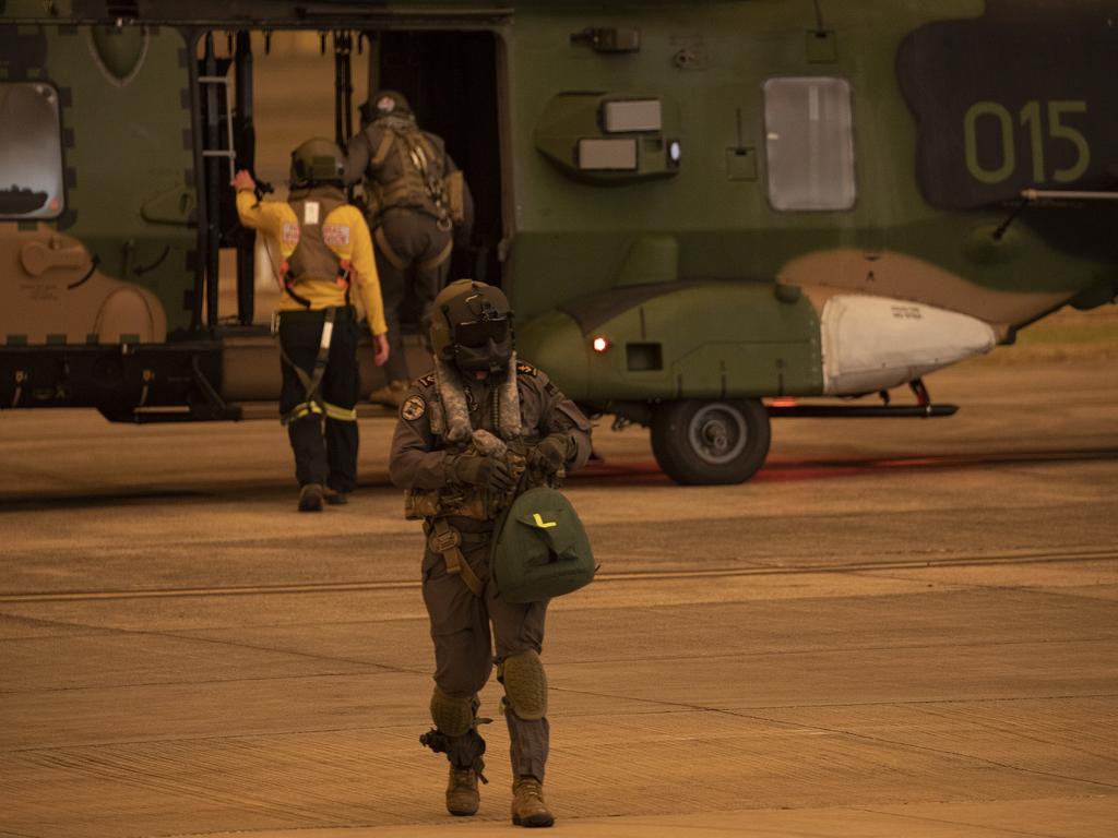 Rural Fire Service employee Dwyane Graham and Royal Australian Navy Aircrewman Leading Seaman Brendan Menz on the 808 Squadron Flight line at HMAS Albatross, Nowra. Picture: ADF