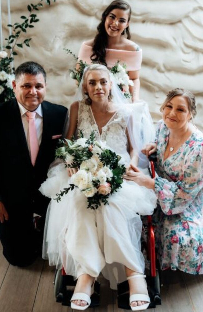 Ashleigh surrounded by her parents Tony and Tracey and sister Chelsea.