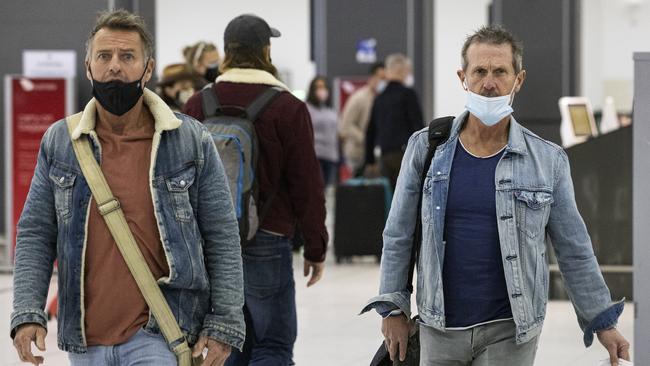 Travellers at Melbourne airport the day lockdown was announced. Picture: Daniel Pockett/Getty Images