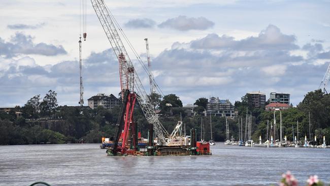 A pontoon crane that dislodged and caused mass evacuations from all sides of the river as it began to sink. Picture: Amanda Parkinson