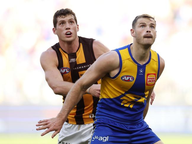 Lloyd Meek of the Hawks contests a ruck contest with Matt Flynn. (Photo by Will Russell/AFL Photos via Getty Images)