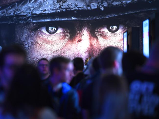 Visitors wait at the stand of Call of Duty during the gaming fair "gamescom" in Cologne, Germany in Augustr. Picture: Patrik Stollarz