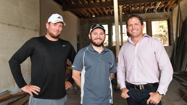 Developers and joint owners of the historic Queens Building, Kayle Wright and Brodie Jankovic with Deputy Mayor Mark Molachino. Picture: Shae Beplate.