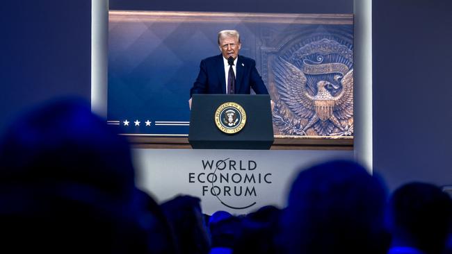 US President Donald Trump is seen on a screen during his address by video conference at the World Economic Forum annual meeting in Davos on January 23, 2025. Picture: AFP