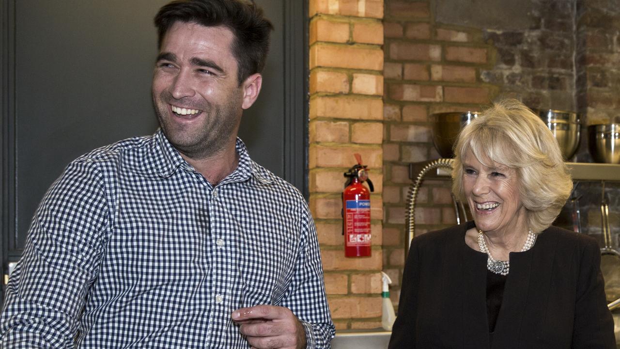 Camilla, the then Duchess of Cornwall attends a reception to mark Australia Day in London getting cooking lesson from Lynton Tapp. Picture: Ella Pellegrini