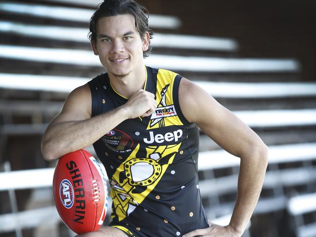 Rioli with the Indigenous Round’s Dreamtime jumper he designed with his parents in the Tiwi Islands. Picture: David Caird