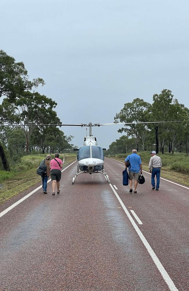 Motorists stranded on the Gregory Hwy between Hann River and Stockyard Ck are helicoptered out on Monday. Credit: Heather Jonsson.