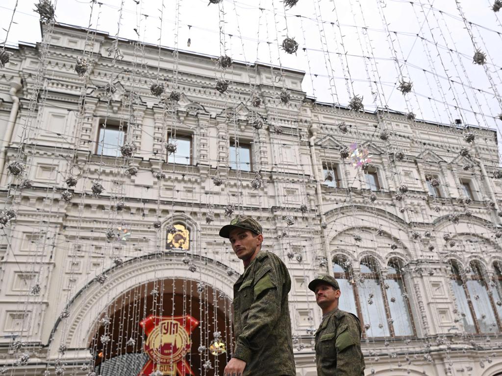 Servicemen walk past the GUM, State Department store, in the centre of Moscow, on June 24, 2023. Russia's President Vladimir Putin on June 24. Picture: Natalia KOLESNIKOVA / AFP