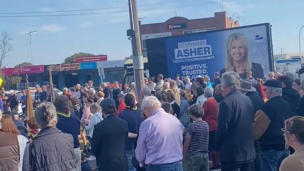 ‘That’s low even for a politician”, one commenter said after video of federal Liberal candidate’s mobile billboard driving past an Anzac Day ceremony was shared online