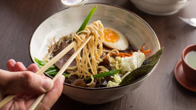 Japanese commuters are being rewarded with free food if they catch less congested subway services. 