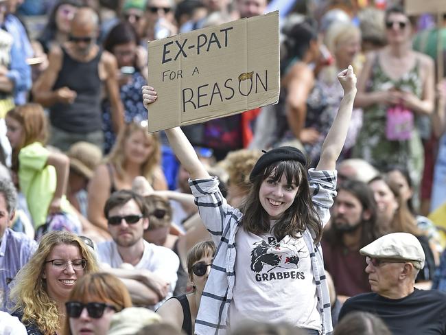 A protester holds up a placard as she takes part in the Scotland United Against Trump demonstration through the streets of Edinburgh, Scotland on July 14, 2018, on the third day of US President Donald Trump's four-day UK visit.    US President Donald Trump wraps up a four-day visit to Britain, dominated by his blasting of Prime Minister Theresa May's Brexit strategy, by spending the weekend in Scotland. / AFP PHOTO / NEIL HANNA