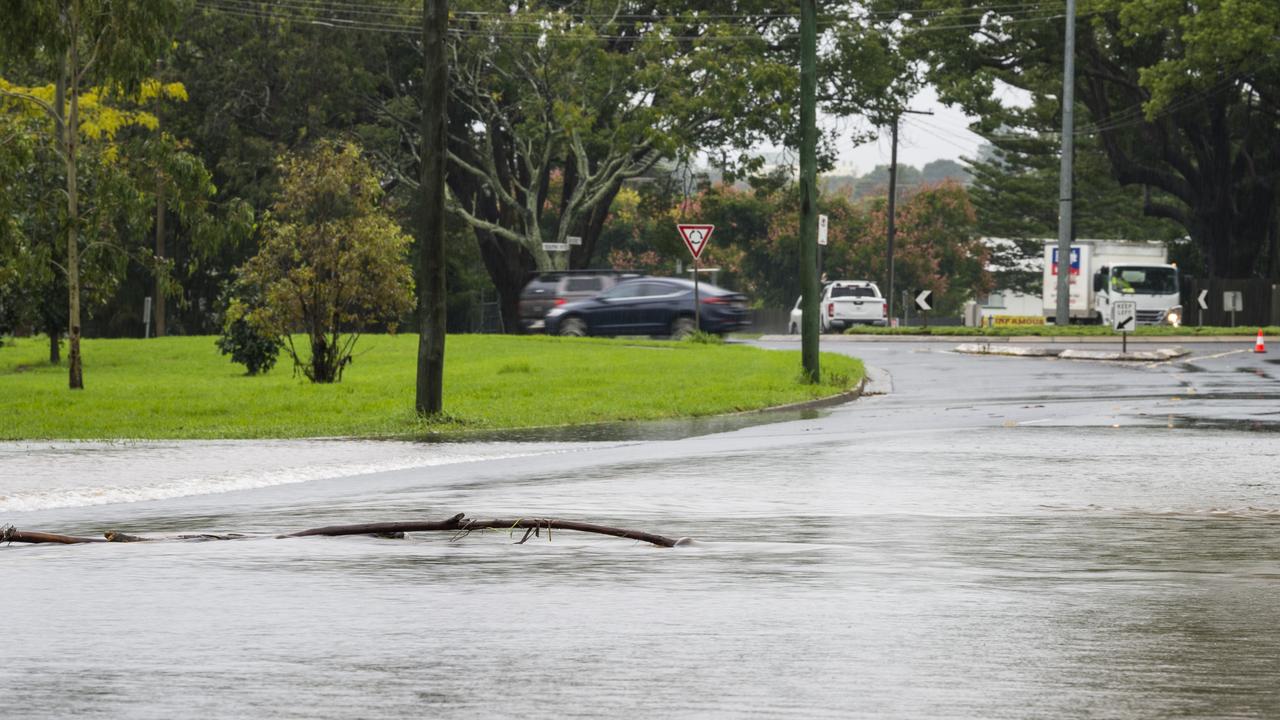 Water over the road closes Mackenzie Street as East Creek flows over near the South Street intersection, Tuesday, March 23, 2021. Picture: Kevin Farmer