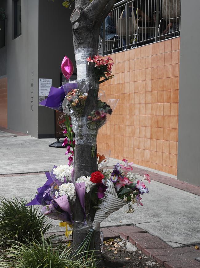 Flowers left at the scene where Haydn Butcher was punched. Picture: John Grainger