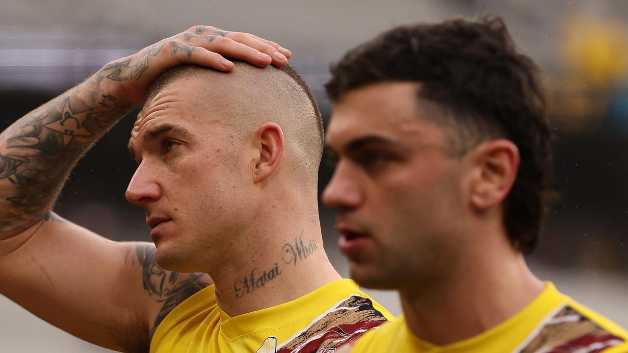 Richmond stars Dustin Martin (left) and Tim Taranto (right) are both battling back injuries ahead of Saturday’s ladder-shaping clash against North Melbourne. Picture: Robert Cianflone / Getty Images