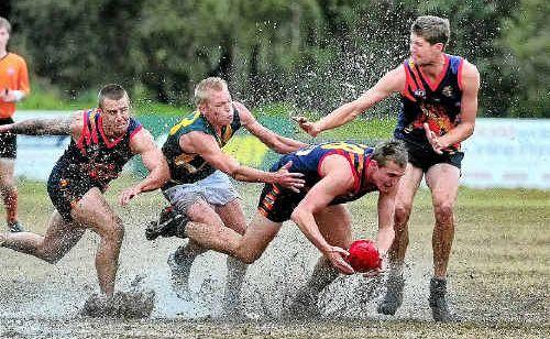 Noosa Tiger Adam Eady tries to control the ball in wet conditions at Weyba Road yesterday during the derby against Maroochy-Northshore. Picture: Geoff Potter