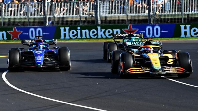 Daniel Ricciardo (R) holds off a challenge from Alexander Albon (L). Picture: Getty