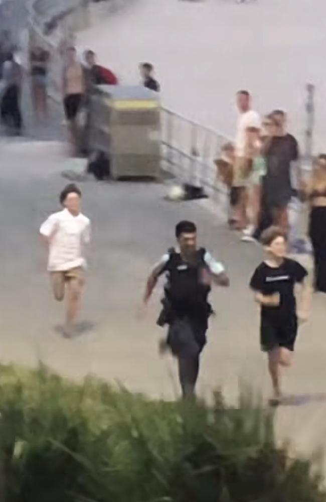 Police officers caught in a playful race against a group of teenagers in Bondi Beach. Picture: Instagram