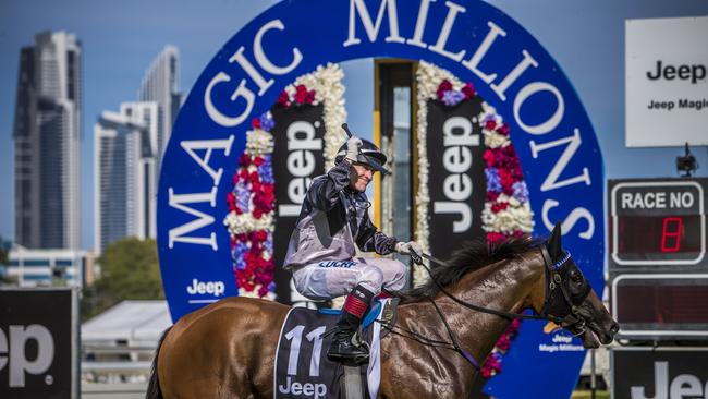 Jockey Jeff Lloyd riding Houtzen wins the Magic Millions 2YO Classic. (AAP Image/Glenn Hunt)