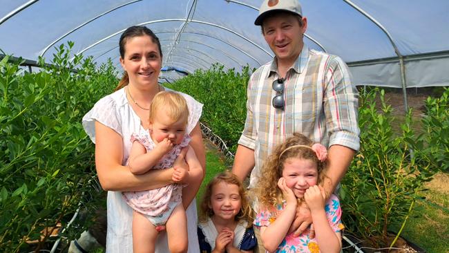 Scott and Allison Carter with their young family at the White Cloud blueberry farm, Corinella, Victoria. PICTURE: Supplied.