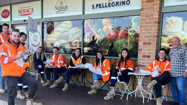 Enzo Di Federico (far right) chats to tradies who tuck into deli sandwiches. Picture: Facebook