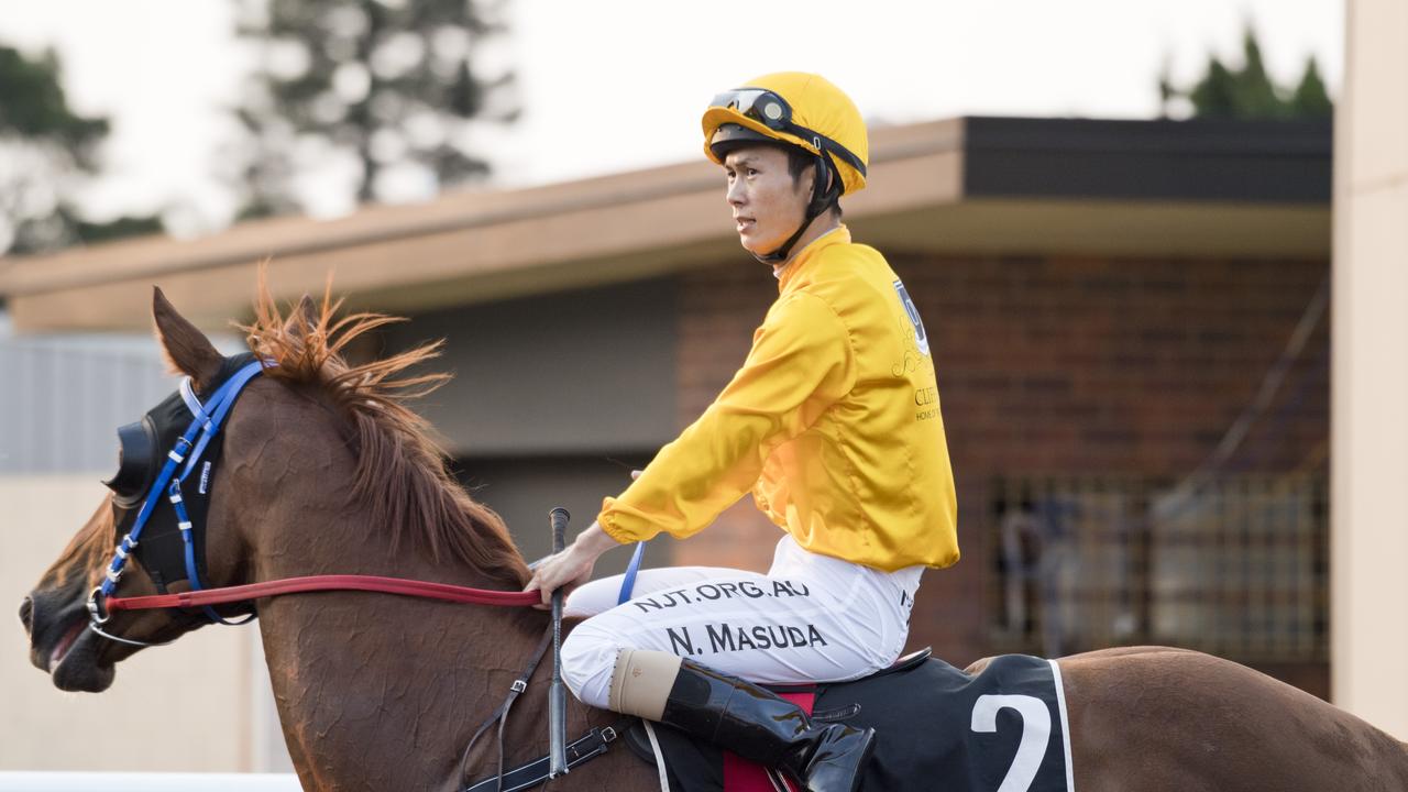 Millen Falcon and apprentice Noriyuki Masuda return to the winner’s stall. Picture: Nev Madsen.