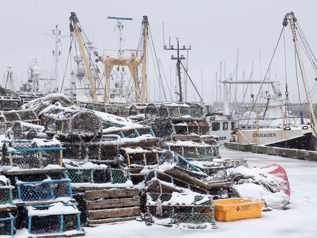 Snow covers lobster pots at the port in the sea side resort of Scarborough in North Yorkshire on February 27, 2018. A blast of Siberian weather sent temperatures plunging across much of Europe on Tuesday, causing headaches for travellers and leading to several deaths from exposure as snow carpeted palm-lined Mediterranean beaches. Picture: AFP