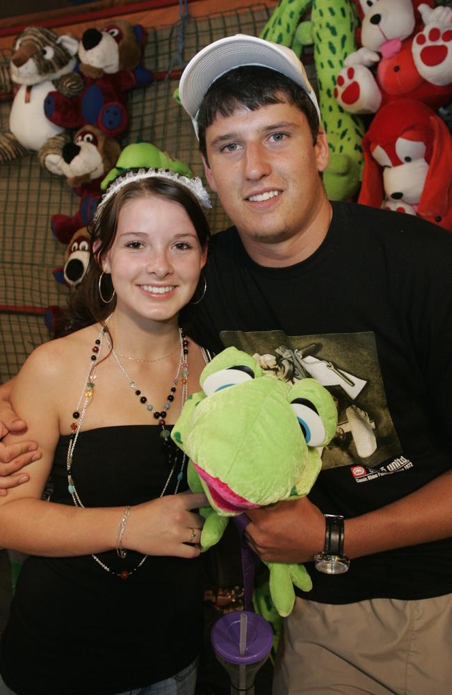 Wade Fuge won his sweetheart, Nicole Richardson, a cute stuffed lizard down at sideshow alley celebrate New Year’s Eve in 2005. Picture: Brett Wortman.