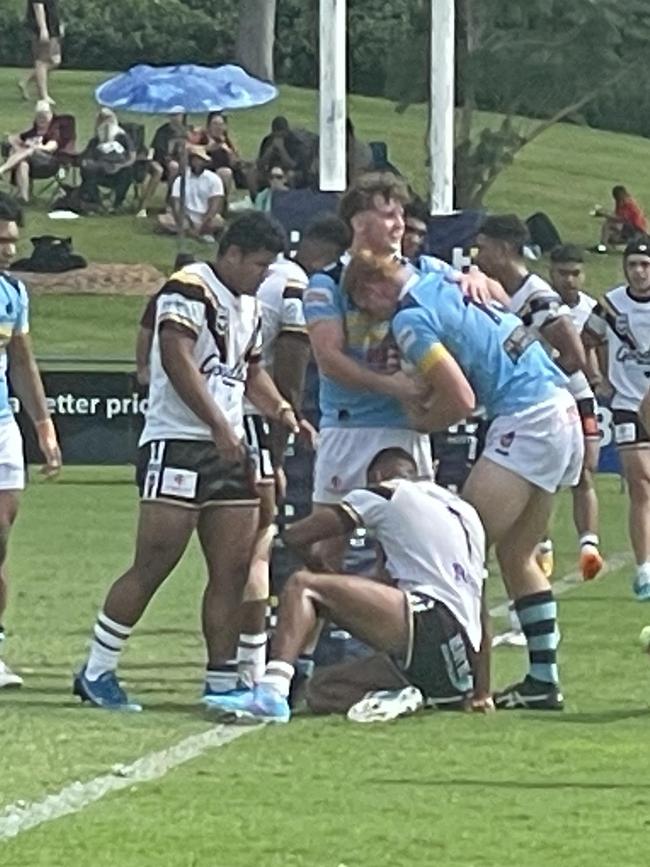 Norths celebrate a try by Ethan Jones.