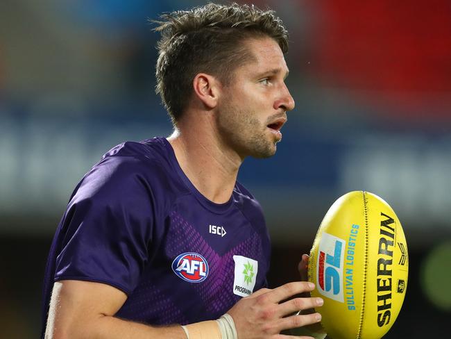 GOLD COAST, AUSTRALIA - JUNE 27: Jesse Hogan of the Dockers warms up before the round 4 AFL match between the Gold Coast Suns and Fremantle Dockers at Metricon Stadium on June 27, 2020 in Gold Coast, Australia. (Photo by Chris Hyde/Getty Images)