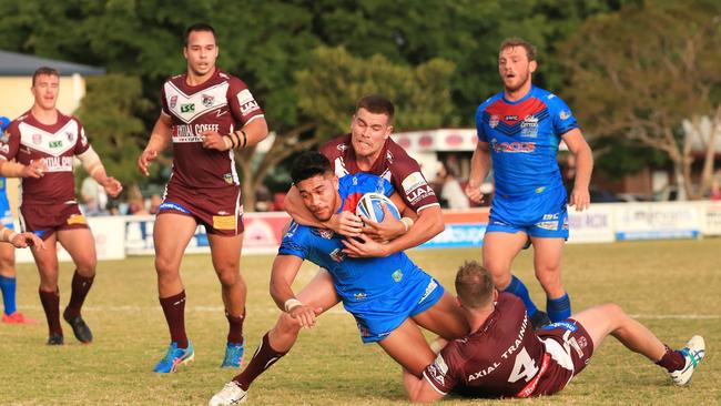 Wells makes a tackle against the Mackay Cutters. Picture: SMP Images