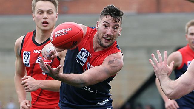 Casey Demon James “Jimmy’’ Munro gets away a handball.