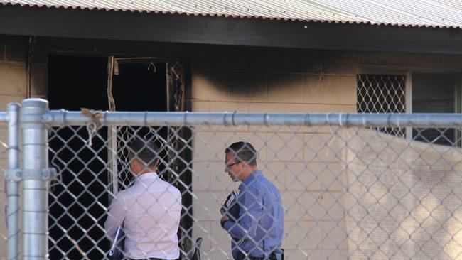 Investigators at the Ptilotus Cres house after it was gutted by a fire. Picture: Gera Kazakov