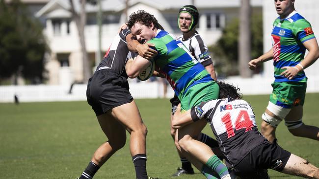 Campbell Moller is tackled by Magpies Henry Hourigan. Picture: Renae Droop