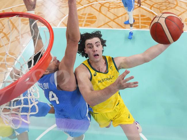 LILLE, FRANCE - AUGUST 02: (EDITORS NOTE: Image was captured using a remote camera positioned above the field of play) Josh Giddey #3 of Team Australia drives to the basket during the Men's Group Phase - Group A match between Team Australia and Team Greece on day seven of the Olympic Games Paris 2024 at Stade Pierre Mauroy on August 02, 2024 in Lille, France. (Photo by Pool/Getty Images)