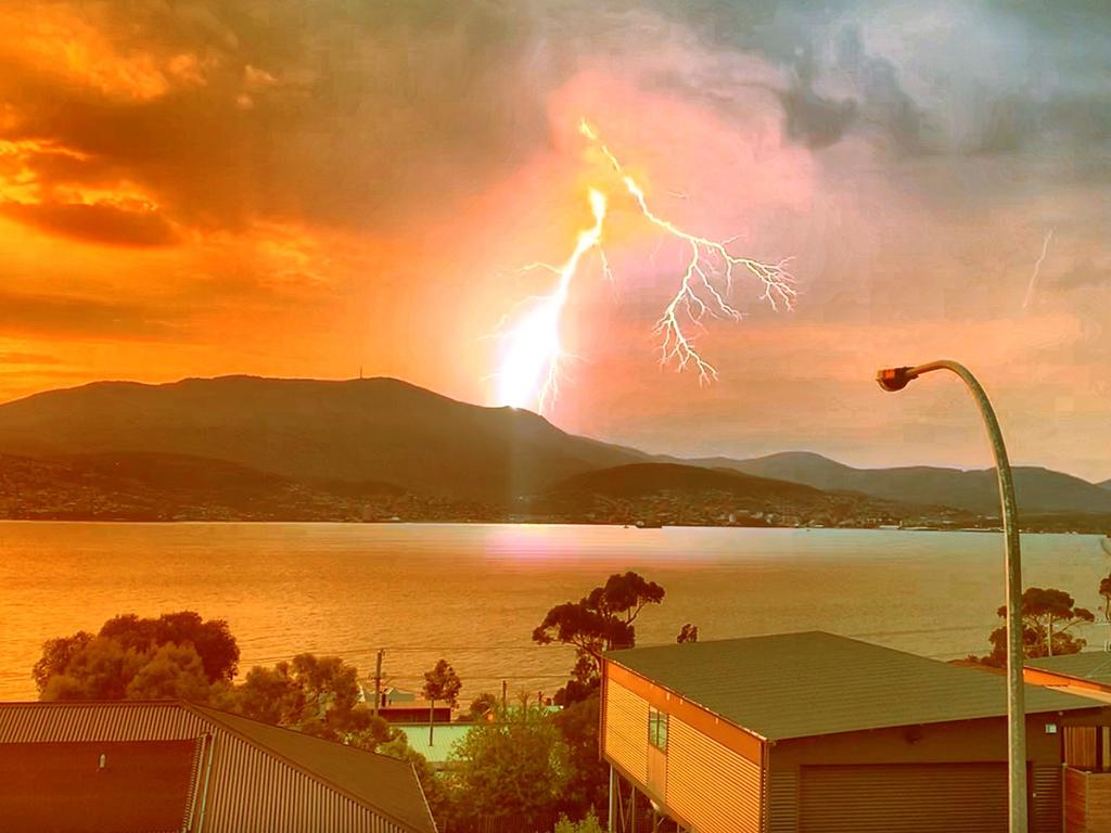 Reader Shane Mundy captured this terrific image of the lightning storm in Hobart from Tranmere last night. Picture: SHANE MUNDY