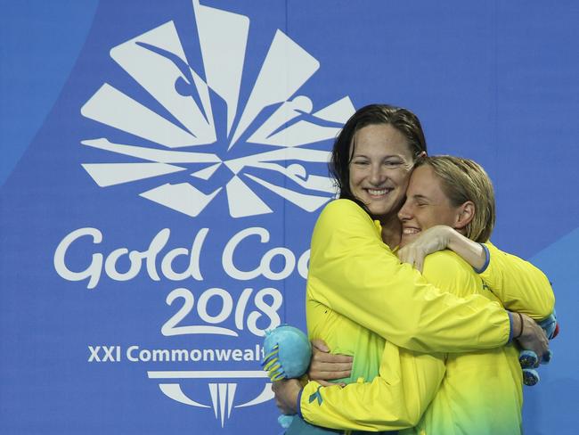 Cate Campbell (left) says she’s been inspired by sister Bronte’s upset win in the 100m freestyle. Picture: AP Photo/Rick Rycroft