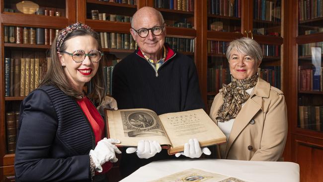 In The Bolton Reading Room are (from left) Councillor Melissa Taylor, Ian Knox and Louise Boyle admiring A Journal of a Voyage to the South Seas in His Majesty's Ship, The Endeavour by Sydney Parkinson, 1773 and (foreground) the Doctorate of Jabez Cay from the University of Padua, 1688 at Toowoomba Regional Art Gallery, Thursday, July 18, 2024. Picture: Kevin Farmer