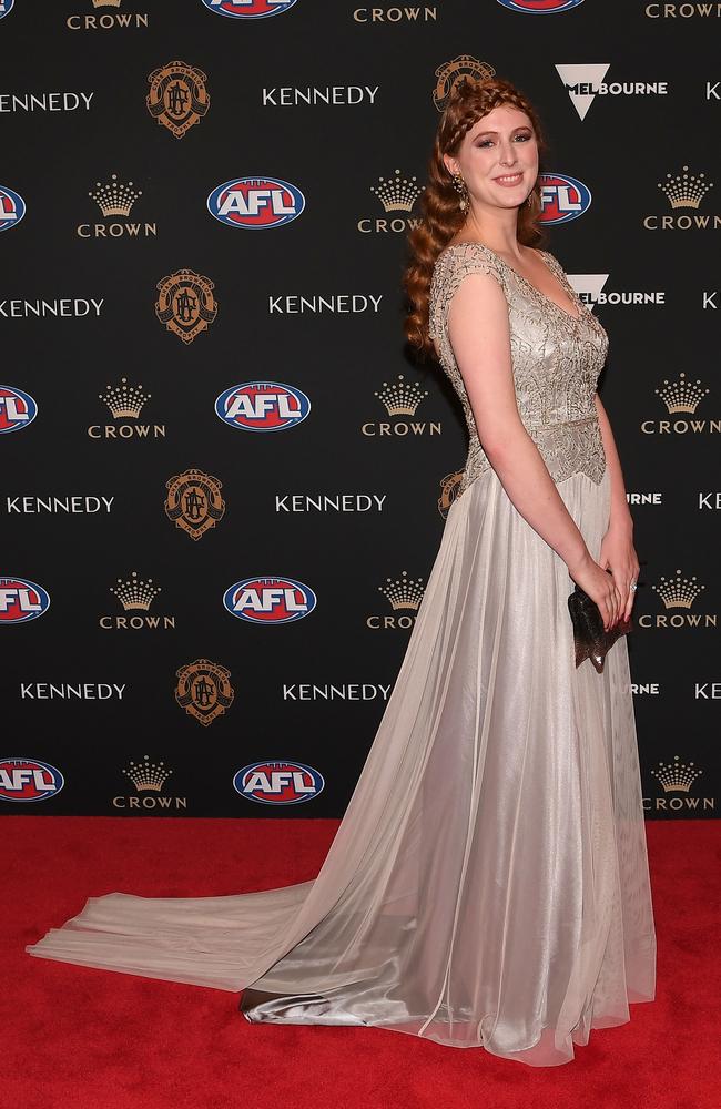 Hester Brown - partner of Kangaroo Ben Brown - brings so much flair to Brownlow fashion thanks to her individual style that fuses art deco with a modern twist. She is wearing a gown by Melbourne designer Gwendolynne. Picture: AAP