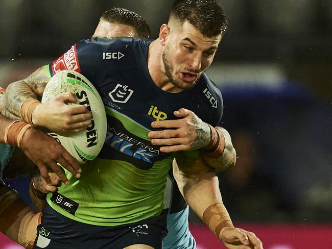 SYDNEY, AUSTRALIA - MARCH 21: Curtis Scott of the Raiders is tackled during the round two NRL match between the Cronulla Sharks and the Canberra Raiders at Netstrata Jubilee Stadium, on March 21, 2021, in Sydney, Australia. (Photo by Brett Hemmings/Getty Images)