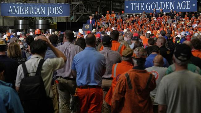 President Trump speaks to steel workers surrounded by banners reading ‘American Jobs’ and ‘The Golden Age’ in Pennsylvania. Picture: Julia Demaree Nikhinson / AP Photo