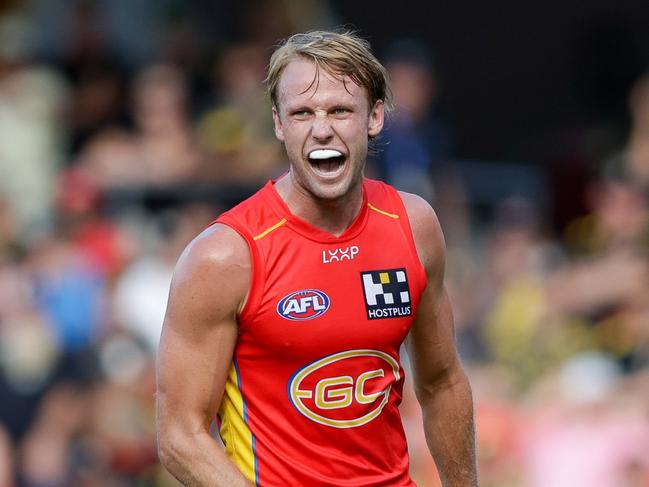 GOLD COAST, AUSTRALIA - MARCH 09: Jack Lukosius of the Suns celebrates a goal during the 2024 AFL Opening Round match between the Gold Coast SUNS and the Richmond Tigers at People First Stadium on March 09, 2024 in Gold Coast, Australia. (Photo by Russell Freeman/AFL Photos via Getty Images)