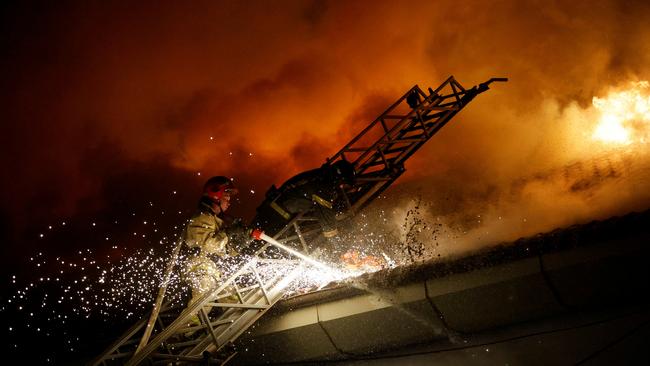 Firefighters extinguish a blaze at a university building following a reported shelling in the Russian-controlled Donetsk region on Saturday. Picture: Reuters