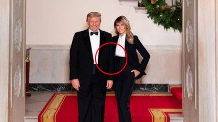 People noticed there is no contact between Mr Trump's arm and Melania's jacket. Also there is no contact shadow at Mr Trump's foot. The photo looks eerily similar to one taken with Prince Charles and Camilla.