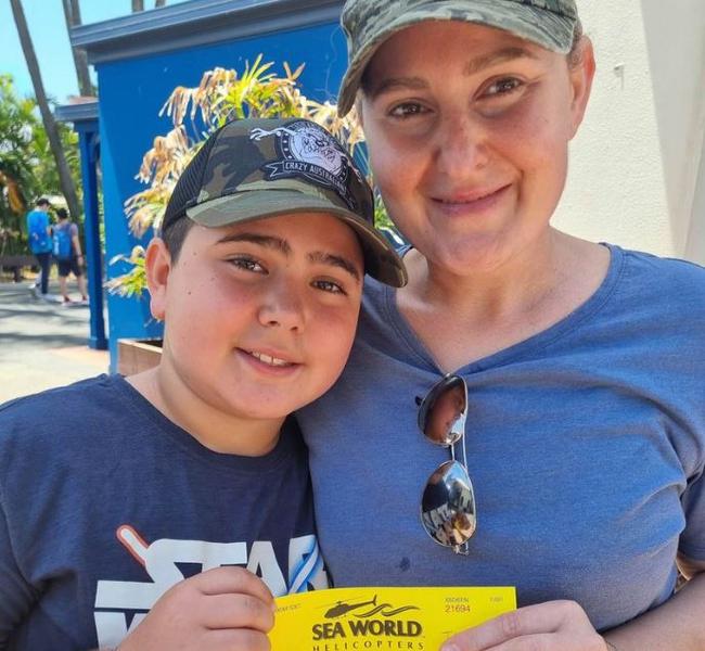 Nicholas Tadros and Vanessa Tadros in the last photo taken of them before two helicopters collided near Sea World. In the photo they can be seen holding the joyride ticket. Picture: 9NEWS