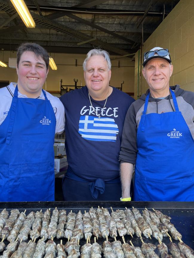 Spiro Elafros, George Elafros and Arthur Elafros fire up the souvlaki for festival volunteers.