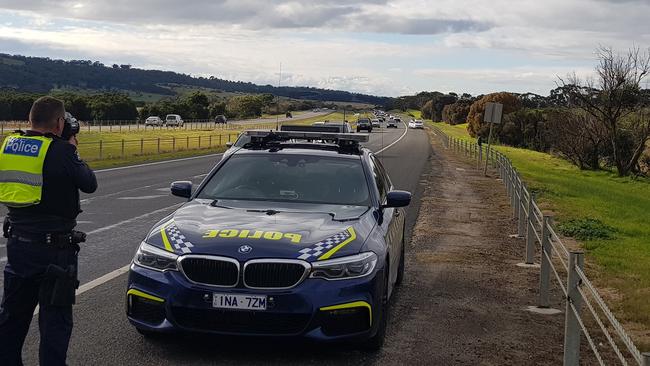 Police conducting Operation Safe-Mate to target drivers speeding past an emergency vehicle with its lights flashing. Source: Supplied